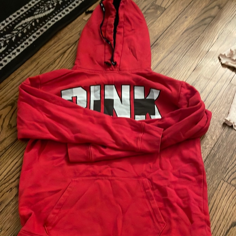 Victoria’s Secret red sweatshirt with black and white print